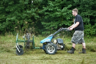 Senior Conservation Officer Tom making hay