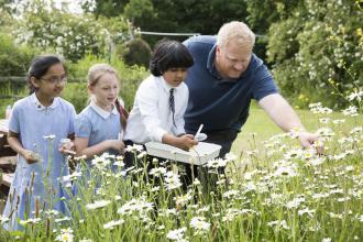 Children learning about wild flowers at EcoPark