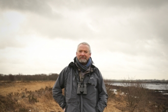 Dave stands on a nature reserve