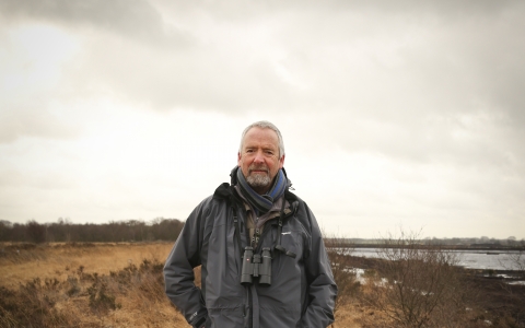 Dave stands on a nature reserve