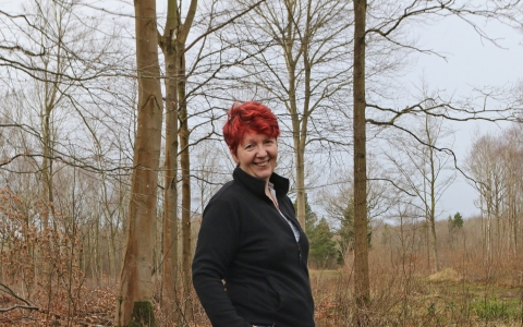 Anne standing in a woodland