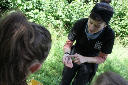 Reserve Officer Natalie telling children about worms