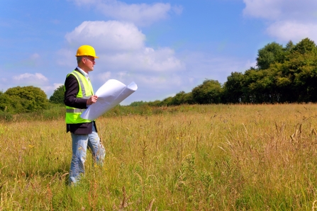 Planner looking at field