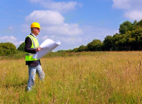 Planner looking at field